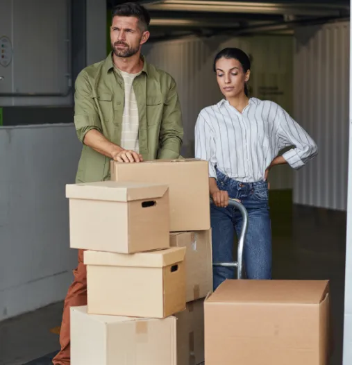 Couple standing in front of boxes